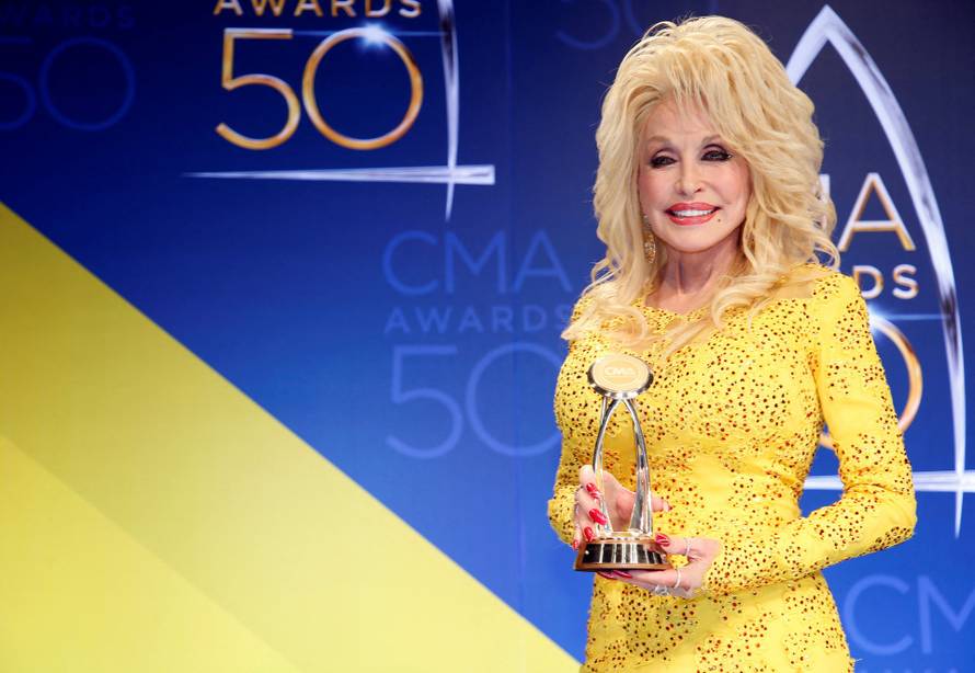 FILE PHOTO: Dolly Parton poses with her award during the 50th Annual Country Music Association Awards in Nashville
