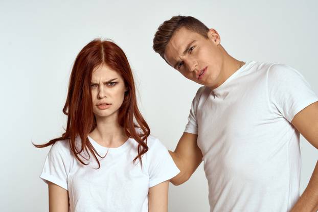 Portrait of man and woman family love emotions light background close-up cropped view