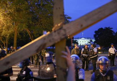 Protestors and police face off by the White House after clashes between police and protestors attempting to pull down statue of U.S. President Andrew Jackson in Washington