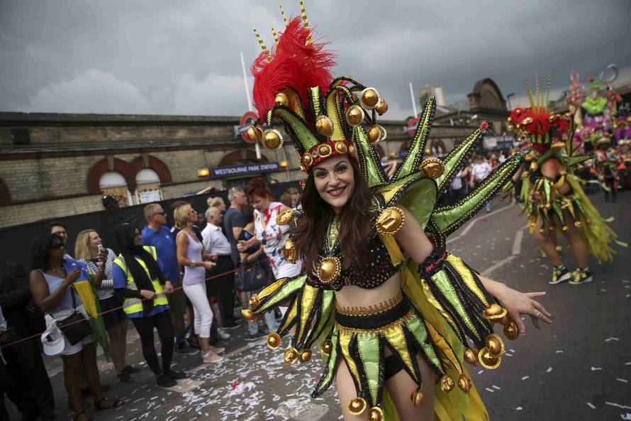 Performers participate in the parade at the Notting Hill Carnival in London