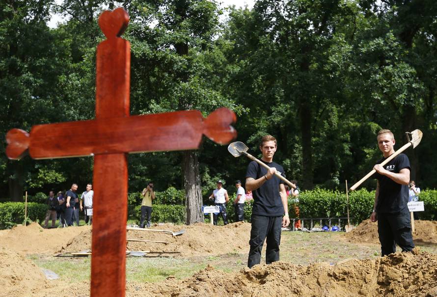 Gravediggers pose after Hungarian grave digging championship in Debrecen