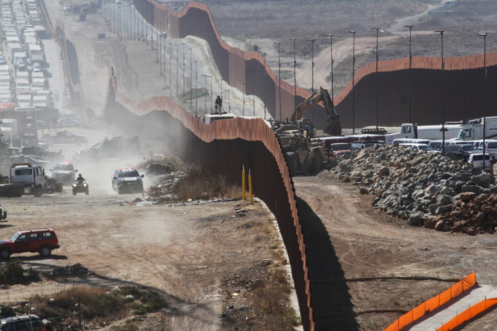 A general view shows Mexican security forces keeping watch at the border fence between Mexico and the United States, ahead of the visit of U.S. President Donald Trump to a section of the border wall in Otay Mesa, California, as pictured from Tijuana