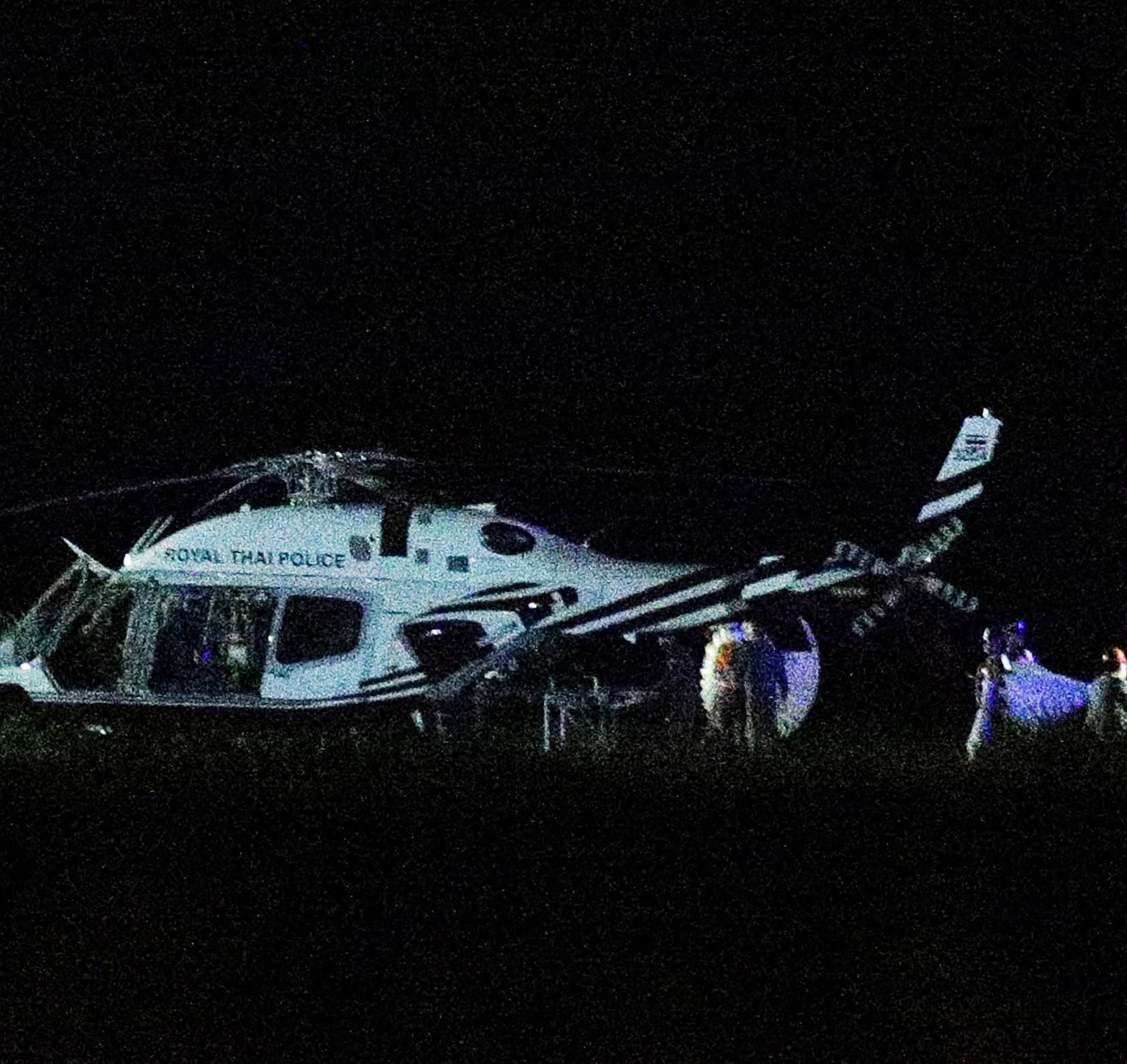 A Royal Thai Police helicopter carrying rescued schoolboys lands at a military airport in the northern province of Chiang Rai