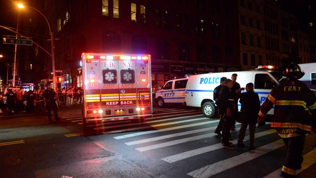 New York City police and firefighters stand near site of explosion in New York