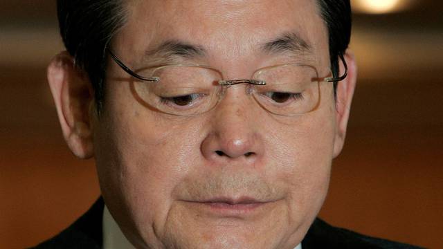 FILE PHOTO: Samsung Group Chairman Lee reacts during a news conference regarding his resignation at the company's headquarters in Seoul