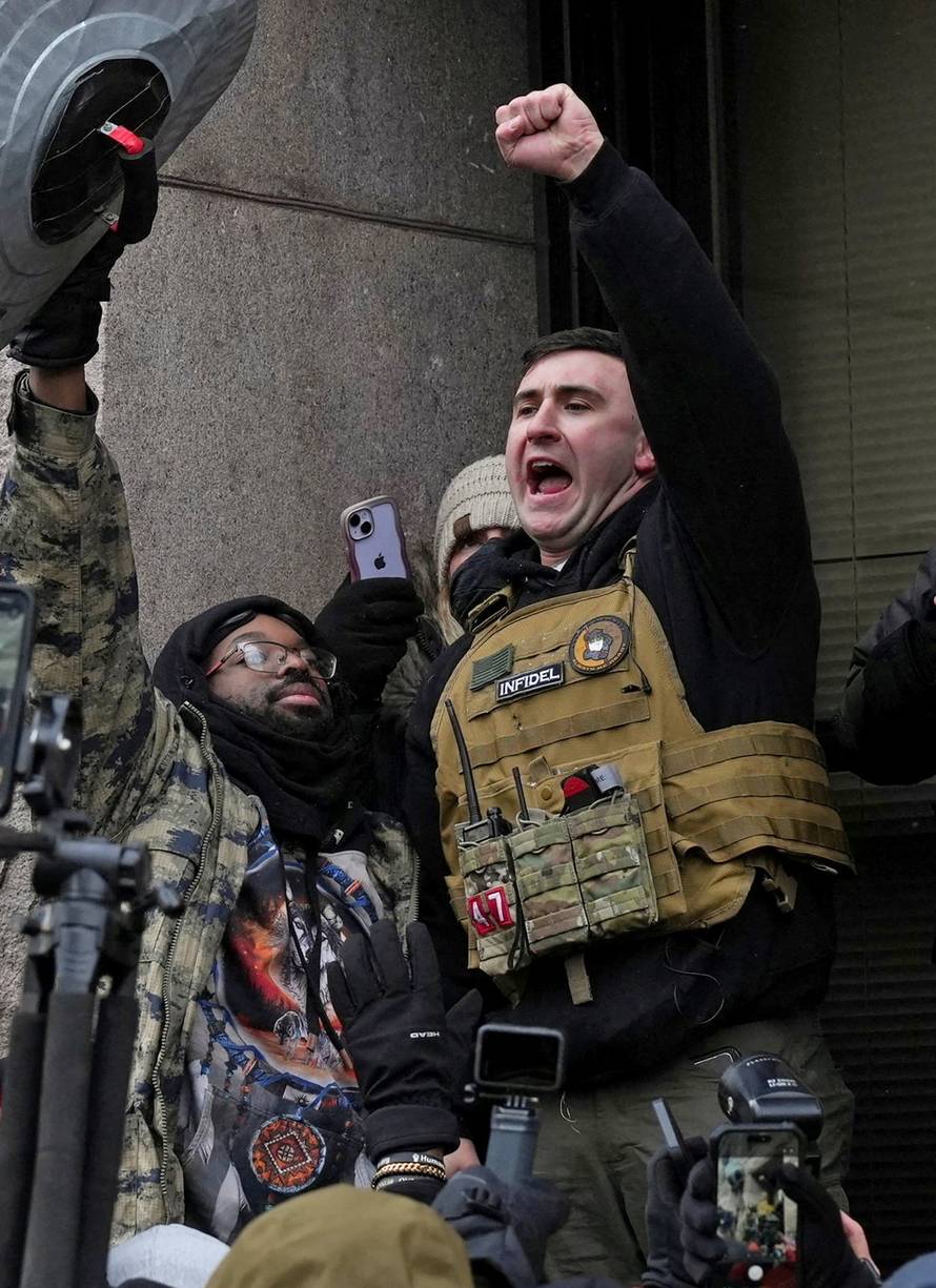 People attend the "March Against Minnesota Fraud" in Minneapolis