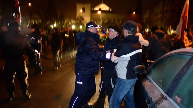 Protesters try to block the exit of the Polish Parliament in Warsaw