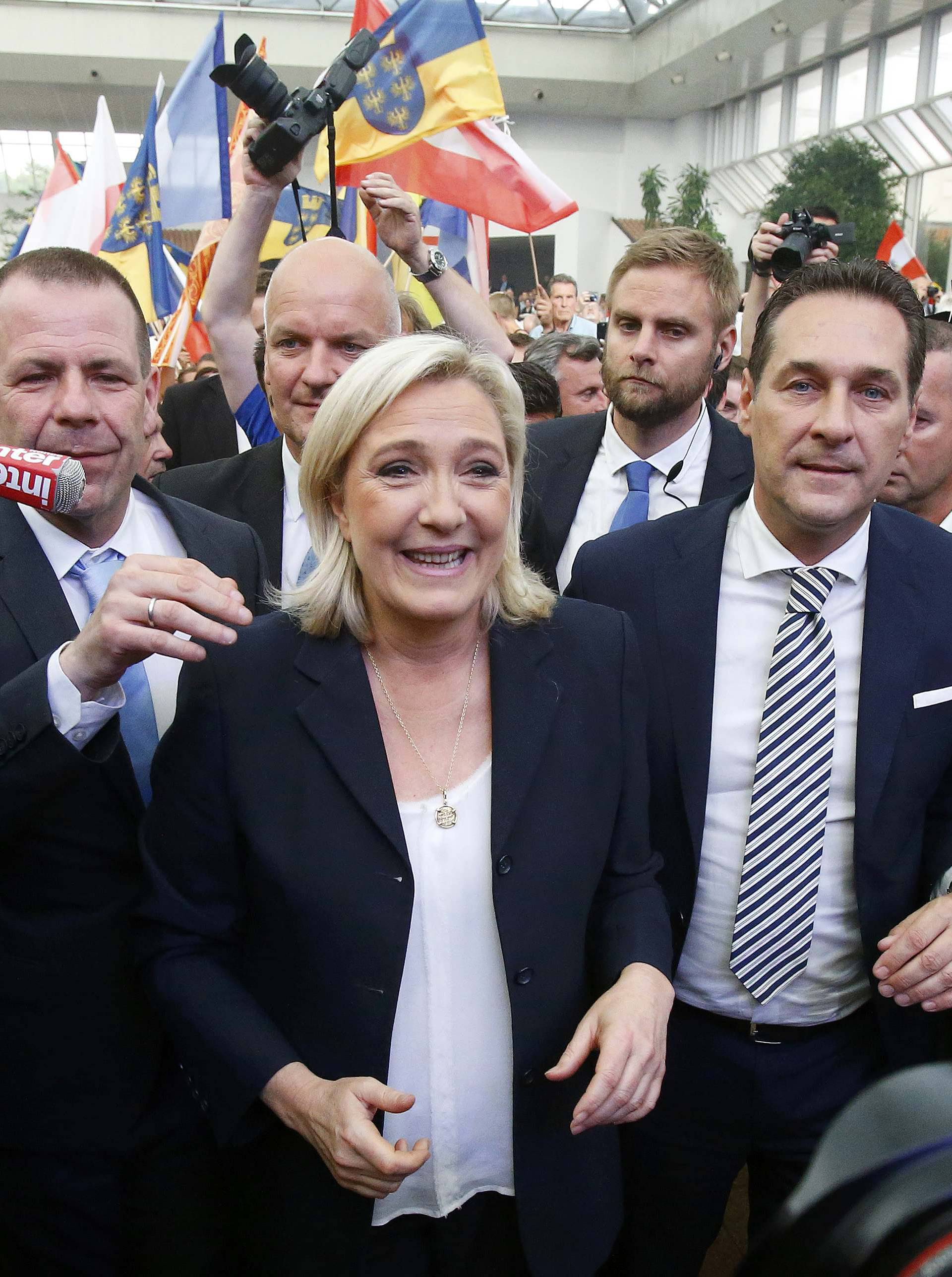 France's far right National Front political party leader Le Pen and Austrian far right FPOe leader Strache arrive at the "Public Meeting on Patriotic Spring" in Vienna