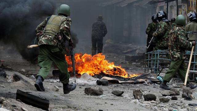 Anti riot policemen clash with protesters supporting opposition leader Raila Odinga in Mathare, in Nairobi