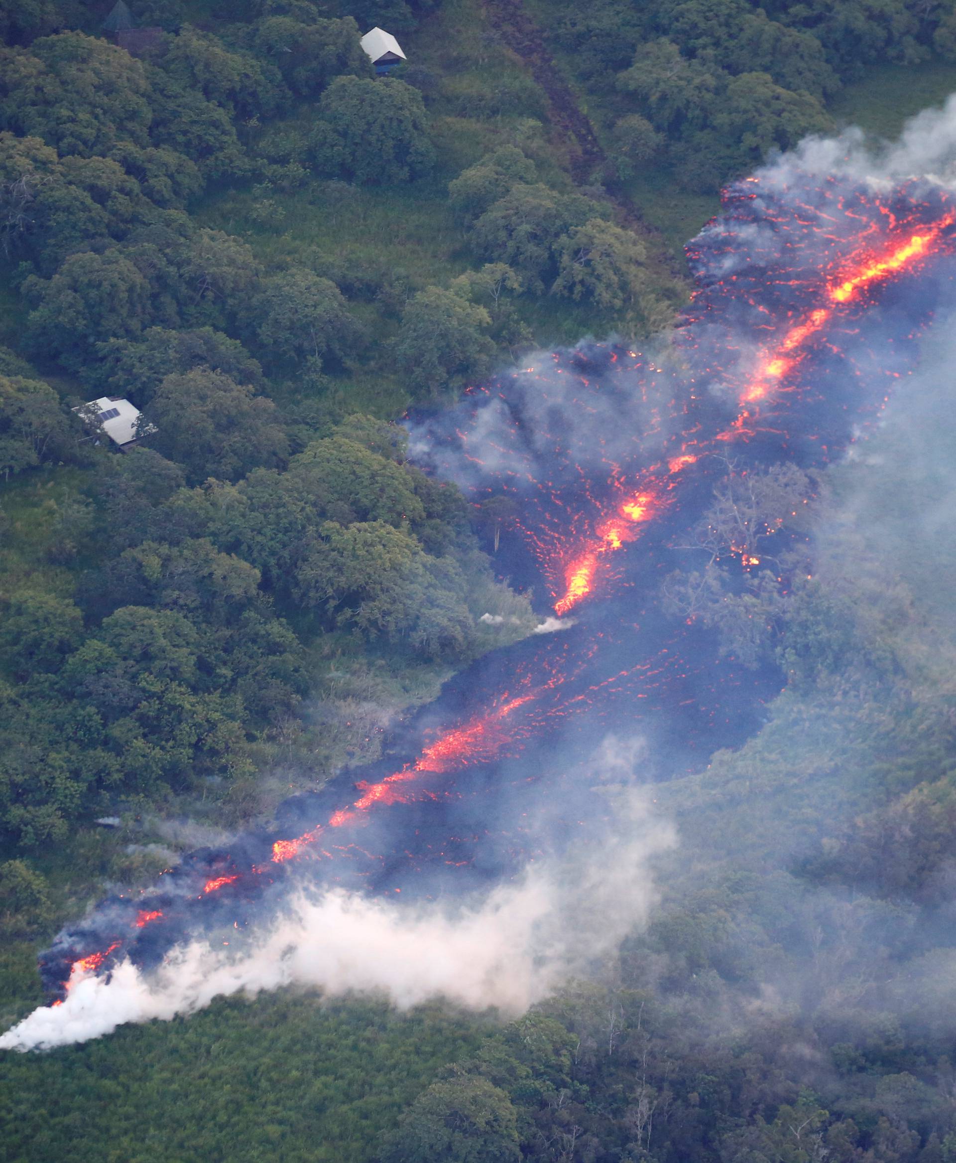 Lava erupts from a fissure east of the Leilani Estates subdivision during ongoing eruptions of the Kilauea Volcano