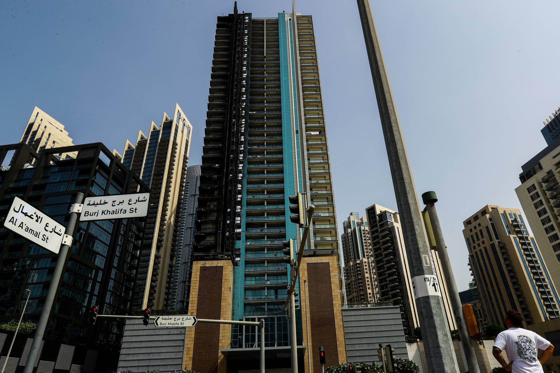 Fire damage is visible on the 8 Boulevard Walk high-rise building located near Burj Khalifa in Dubai