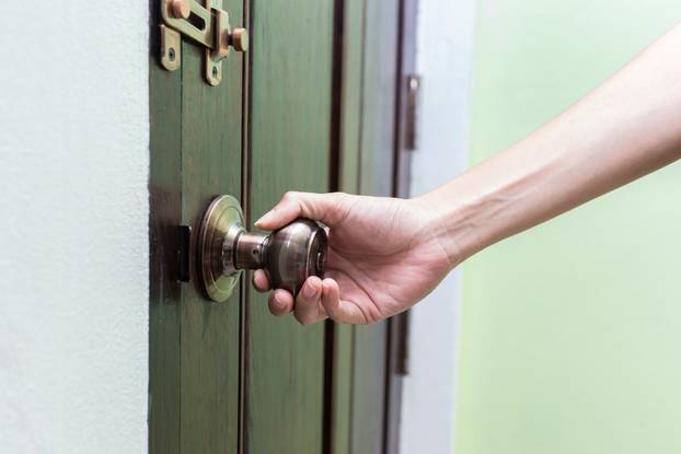hand hold handle of wood door