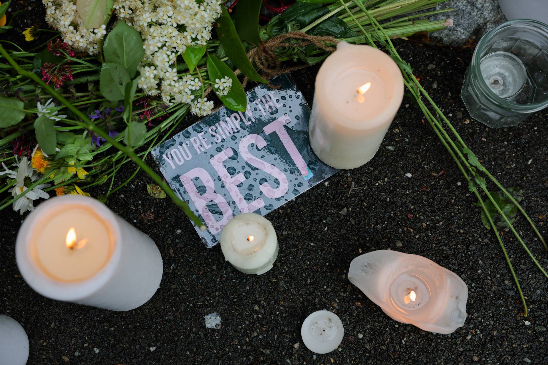 People lay flowers and candles in front of the home of late singer Tina Turner in Kuesnacht