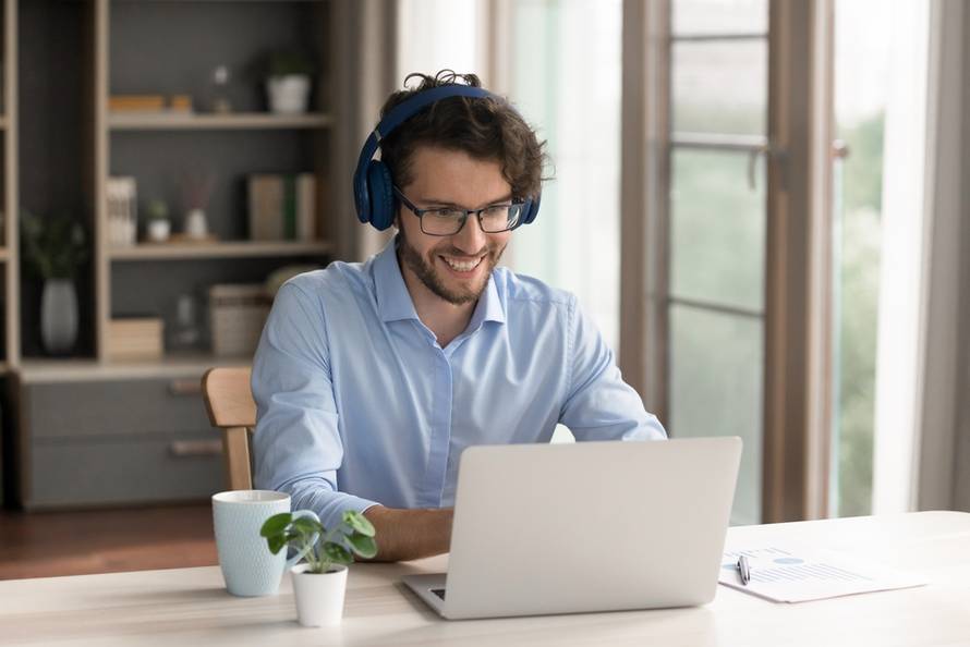 Virtual,Interaction.,Happy,Smiling,Gen,Z,Man,Office,Worker,Freelancer