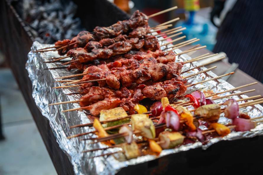 Meat and vegetable kebabs on wooden skewers