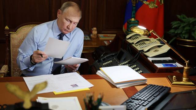 Russian President Vladimir Putin works in his office in Moscow
