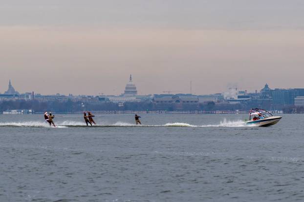 "Waterskiing Santa" skis along the Old Town Alexandria Waterfront in Virginia