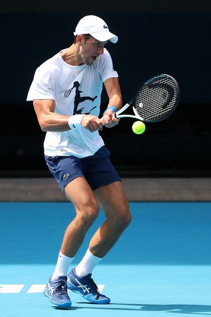 Novak Djokovic practices on court ahead of 2022 Australian Open