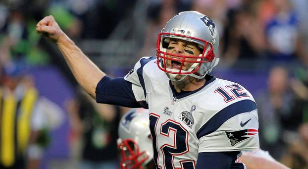 FILE PHOTO: New England Patriots quarterback Brady celebrates his second quarter touchdown pass against the Seattle Seahawks  to wide receiver LaFell during the NFL Super Bowl XLIX football game in Glendale