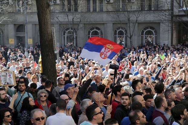 Demonstrators attend a protest against Serbian President Vucic and his government in front of the presidential building in Belgrade