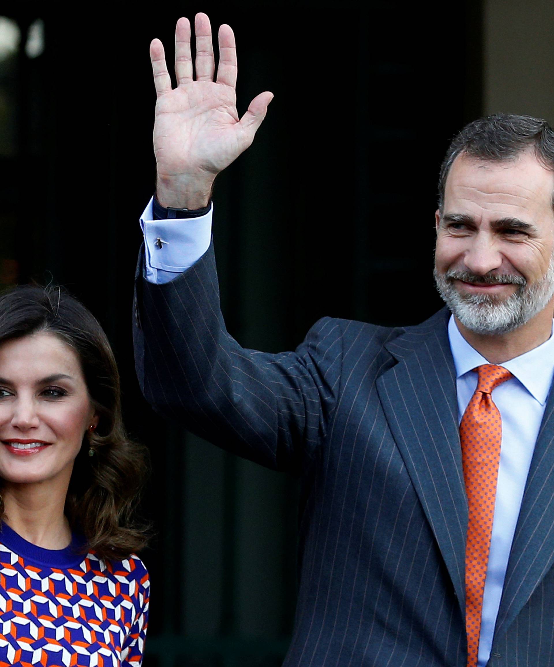 Spain's King Felipe VI and Queen Letizia wave as they arrive at the Cabildo in New Orleans