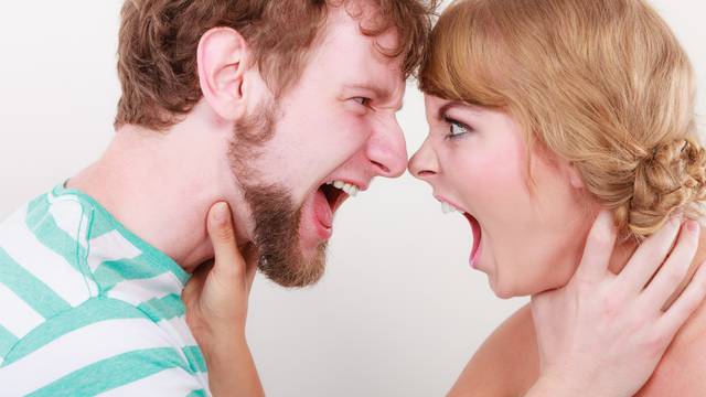 Angry woman and man yelling at each other.
