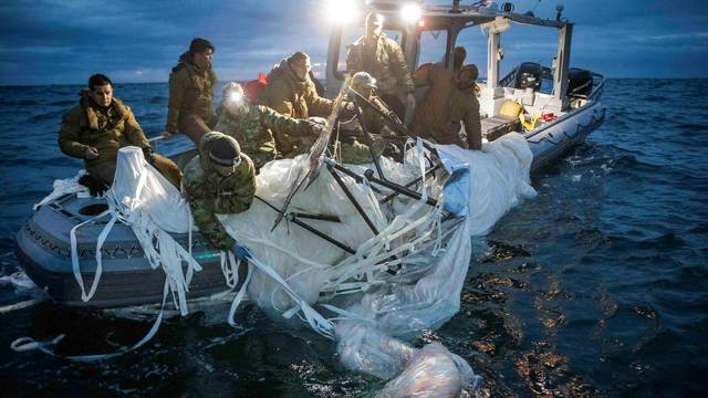 FILE PHOTO: Sailors recover a high-altitude surveillance balloon off the coast of Myrtle Beach, South Carolina