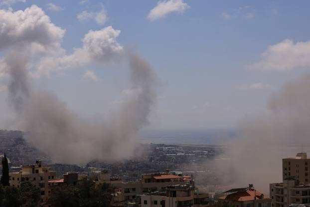 Smoke rises following an Israeli strike on the southern suburbs of Beirut