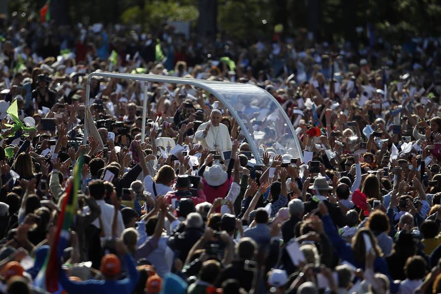 Pope Francis waves as he arrives at the Catholic shrine of Fatima