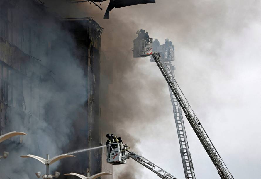 Firefighters extinguish a fire at a business centre in Moscow