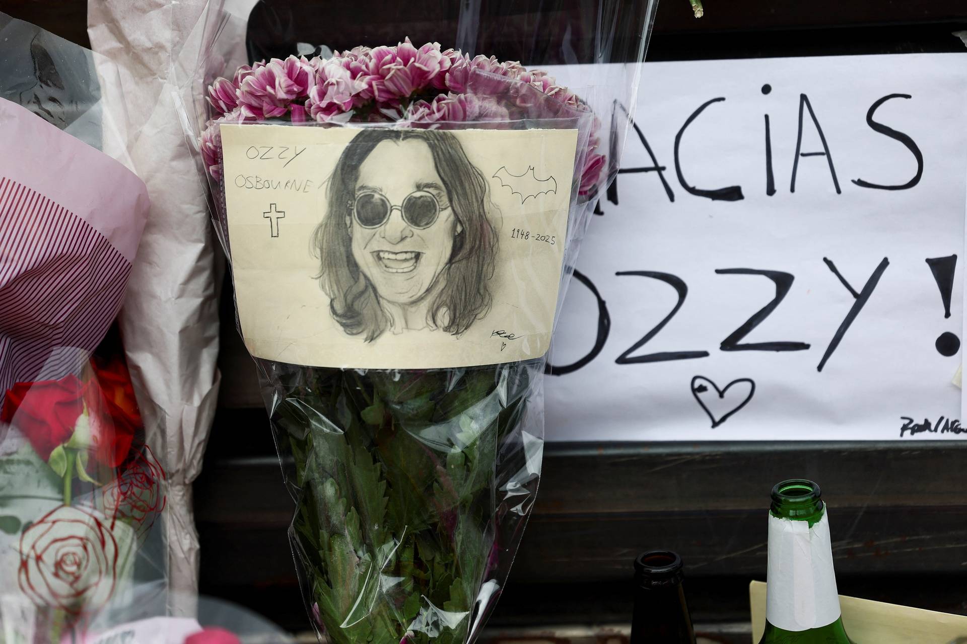 Fans pay tribute following the death of Ozzy Osbourne, in Birmingham