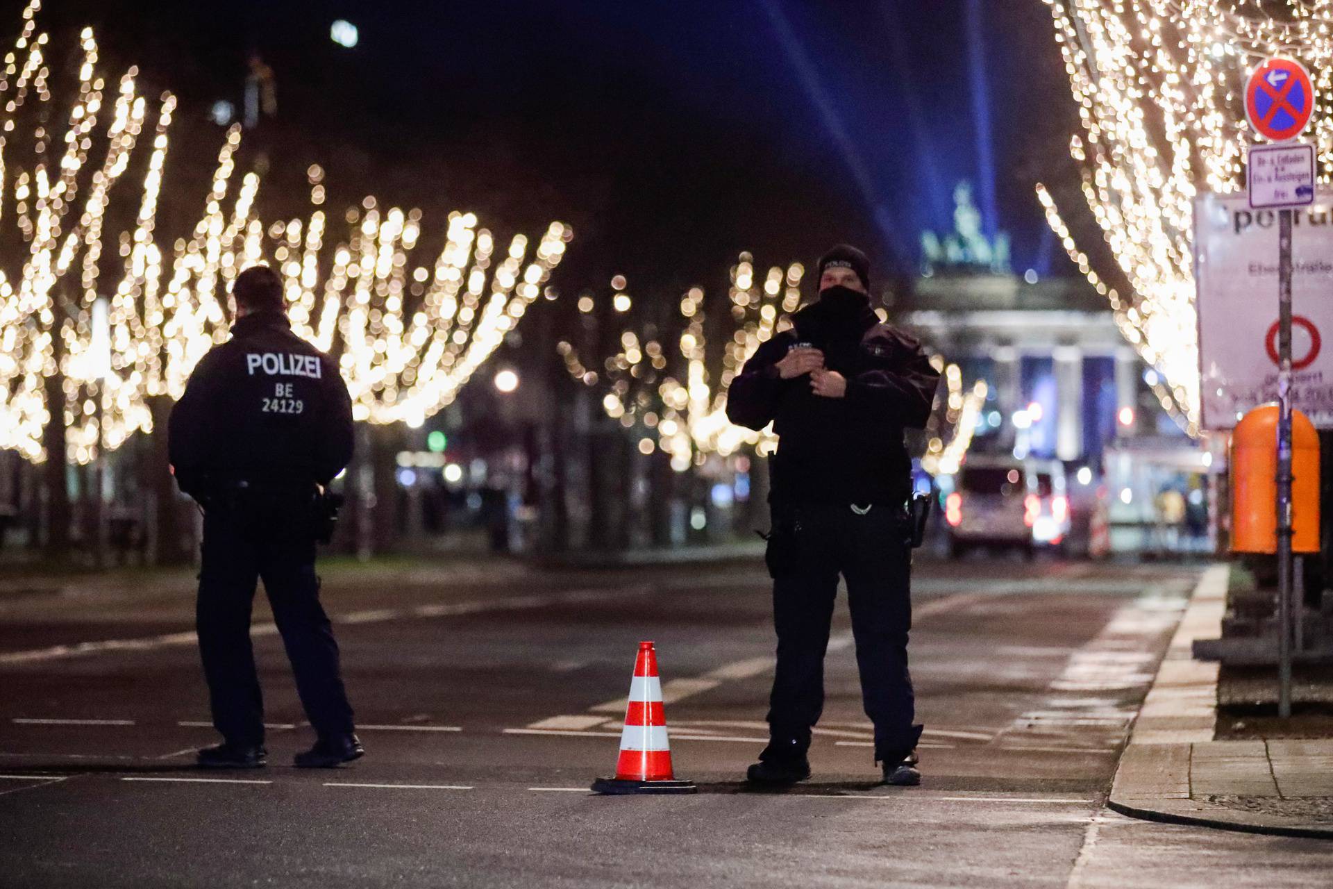 Police officers secure the area near the Brandenburg Gate on New Year's Eve, amid coronavirus disease (COVID-19) restrictions in Berlin