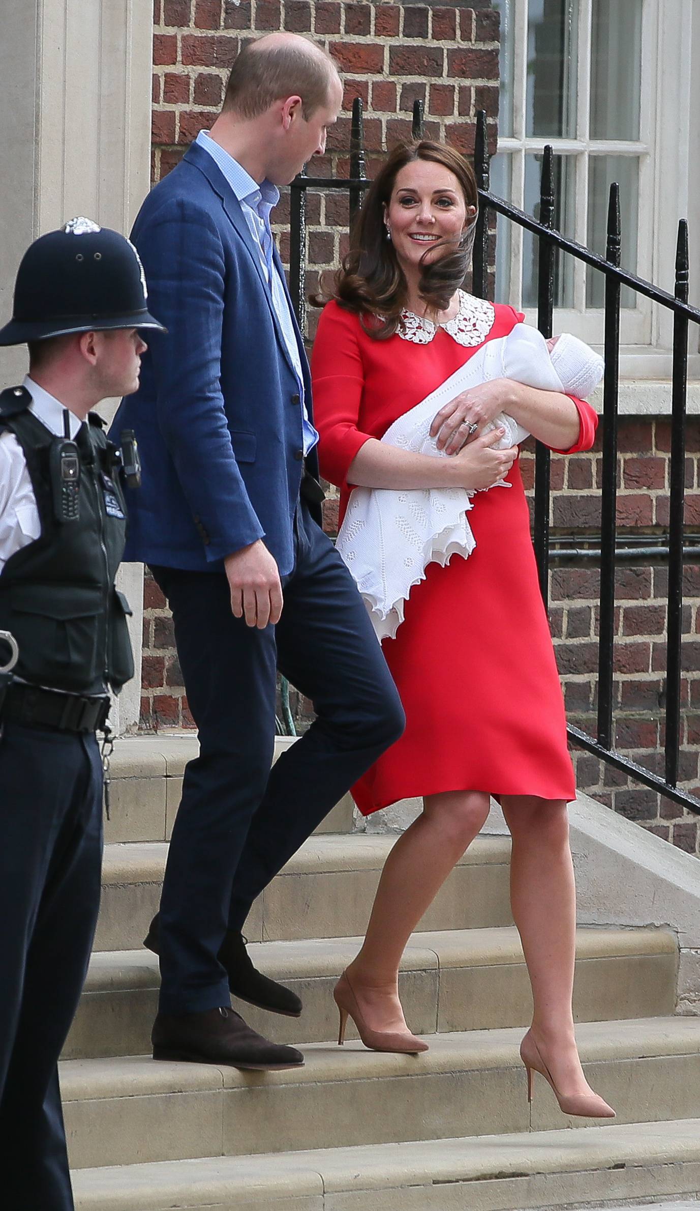 Prince William, Duke of Cambridge and Catherine, Duchess of Cambridge leave St Mary's Hospital with their newborn son