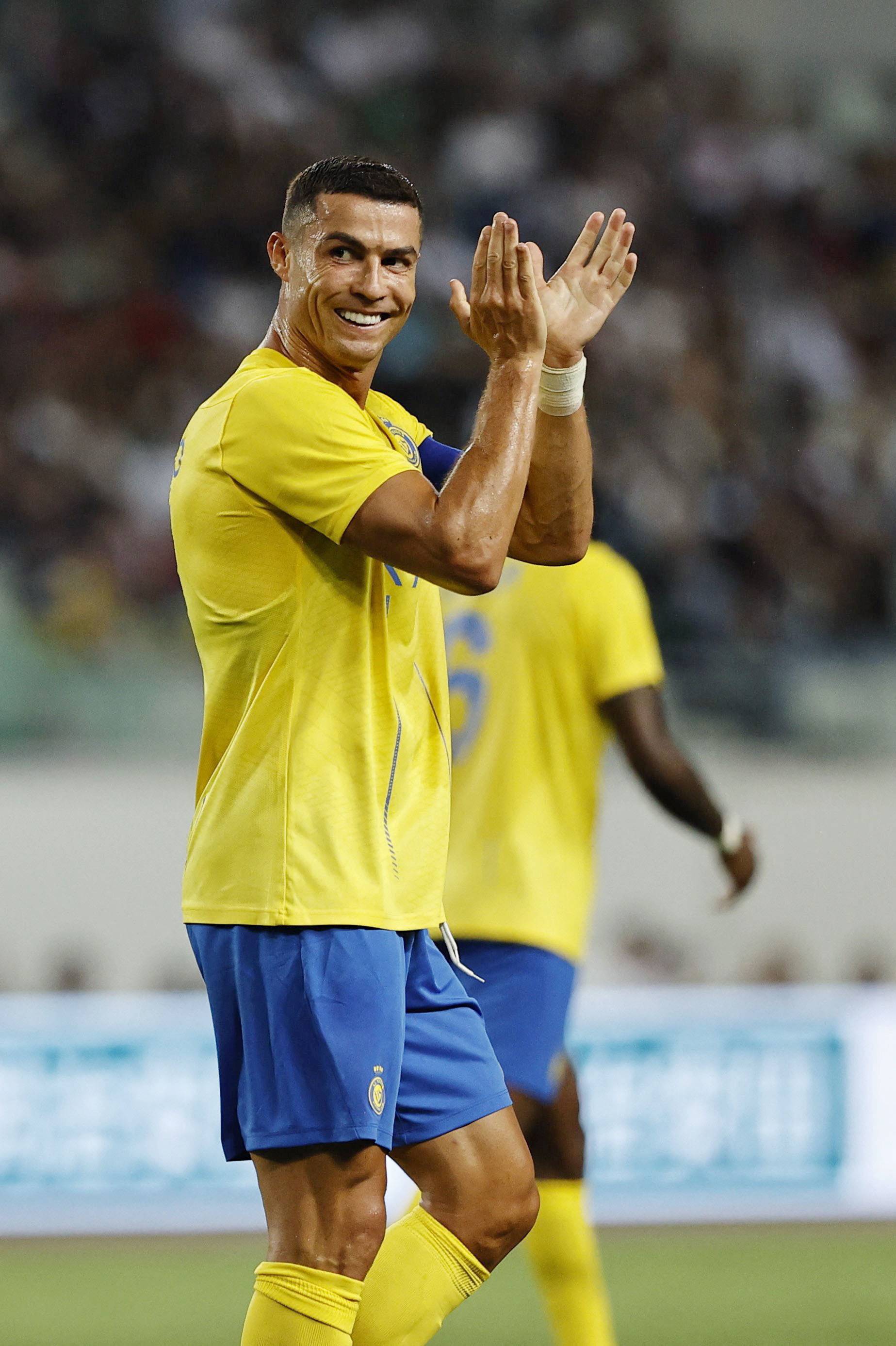 Al Nassr's Cristiano Ronaldo claps during a friendly match against Paris-Saint-Germain at the Nagai Stadium in Osaka