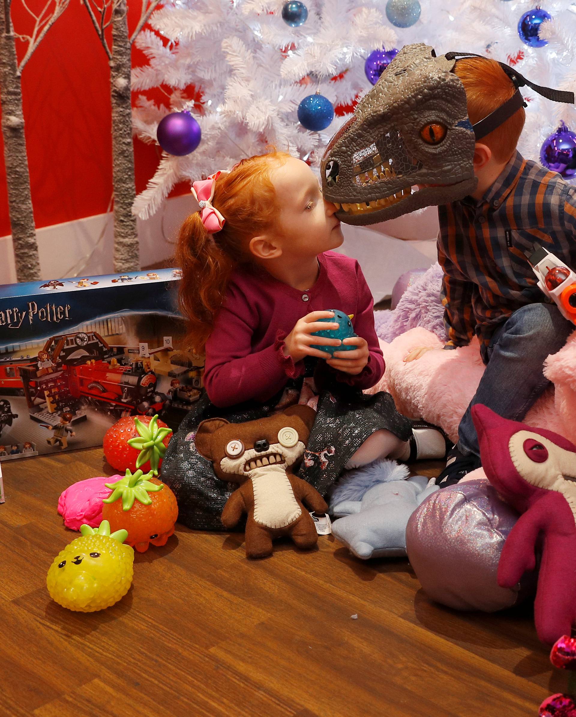 Aston Robertson-Jeyes, aged 3 and her brother Tristan, aged 7, play with some of Hamleys top toys for Christmas at a launch at their store in London