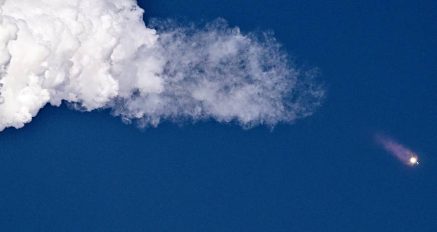 A SpaceX Super Heavy booster carrying the Starship spacecraft lifts off on its 11th test flight