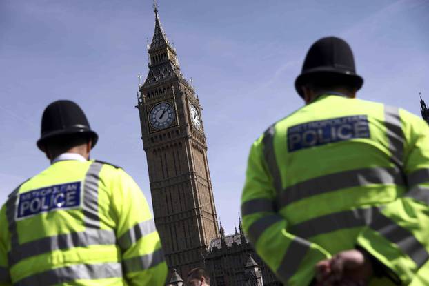 Police officers patrol in Parliament Square following the attack in Westminster earlier in the week, in central London