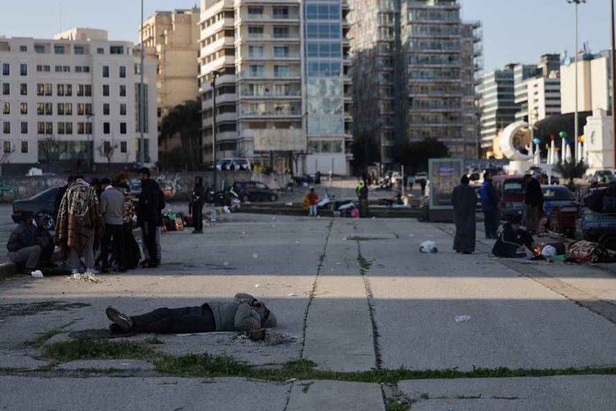 Displaced people from the southern suburbs, gather at Martyrs' Square in Beirut