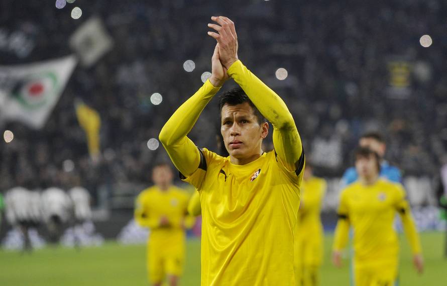 Dinamo Zagreb's Leonardo Sigali applauds fans after the game