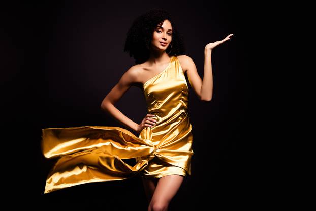 Photo of fancy sendual lady wear gold dress dancing erotic moves isolated black color background