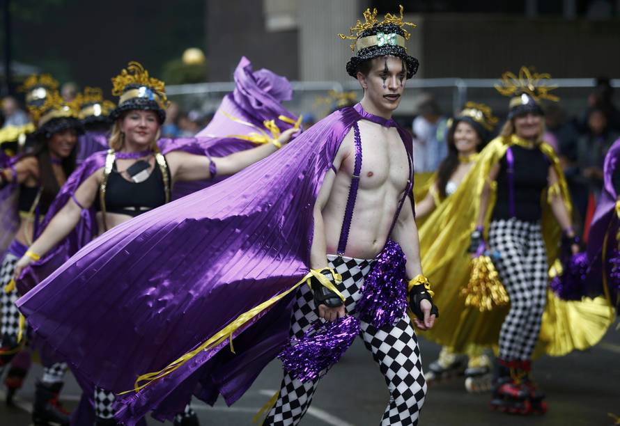 Performers participate in the children's day parade at the Notting Hill Carnival in London