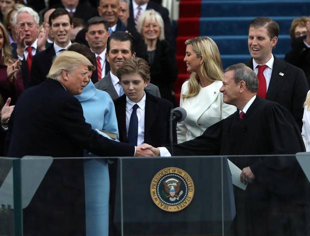 FILE PHOTO: U.S. President Donald Trump shakes hands with U.S. Supreme Court Chief Justice John Roberts during inauguration ceremonies at the Capitol in Washington