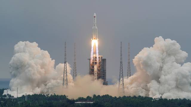 FILE PHOTO: Long March-5B Y2 rocket, carrying the core module of China's space station Tianhe, takes off from Wenchang