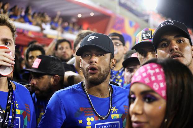 Brazilian soccer player Neymar, Brazilian pro surfer Gabriel Medina and Brazilian singer Anita during the second night of the Carnival parade at the Sambadrome in Rio de Janeiro