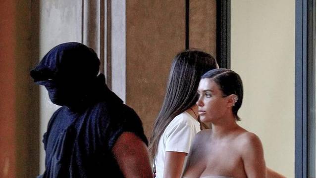 *PREMIUM-EXCLUSIVE* *MUST CALL FOR PRICING* The American Rapper Kanye West in his usual incognito mode is seen with his partner Bianca Censori as they step out of an Italian hotel for some shopping in the center of Florence.