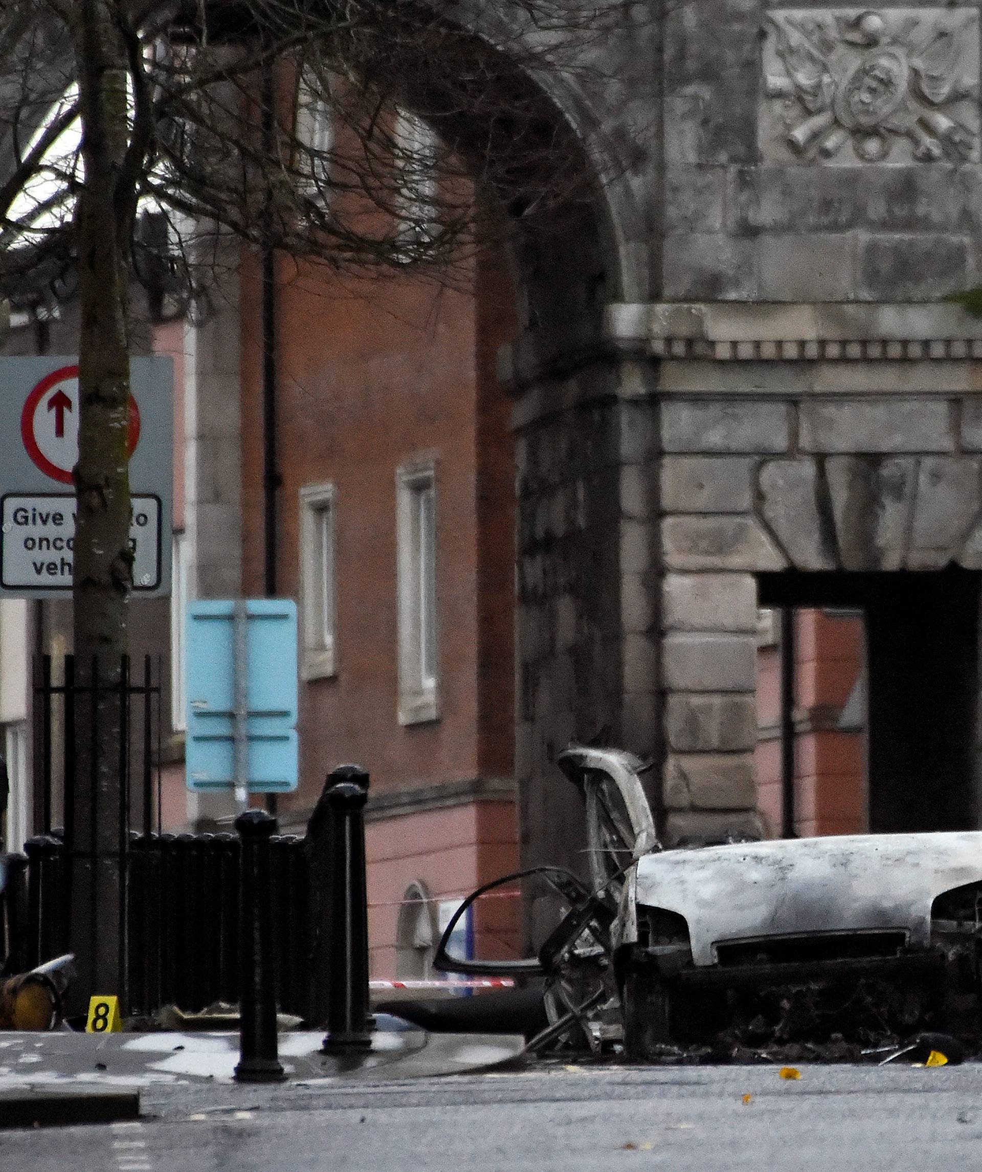 Forensic officers arrive at the scene of a suspected car bomb in Londonderry