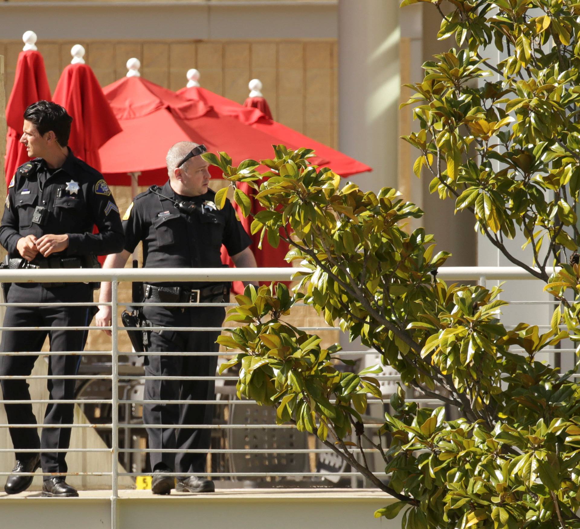 Police officers and crime scene markers are seen at Youtube headquarters following an active shooter situation in San Bruno, California