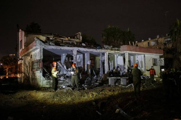 Israeli soldiers attend the scene of damage caused after Iranian missile barrages struck Dimona, amid the U.S.-Israel conflict with Iran, in southern Israel