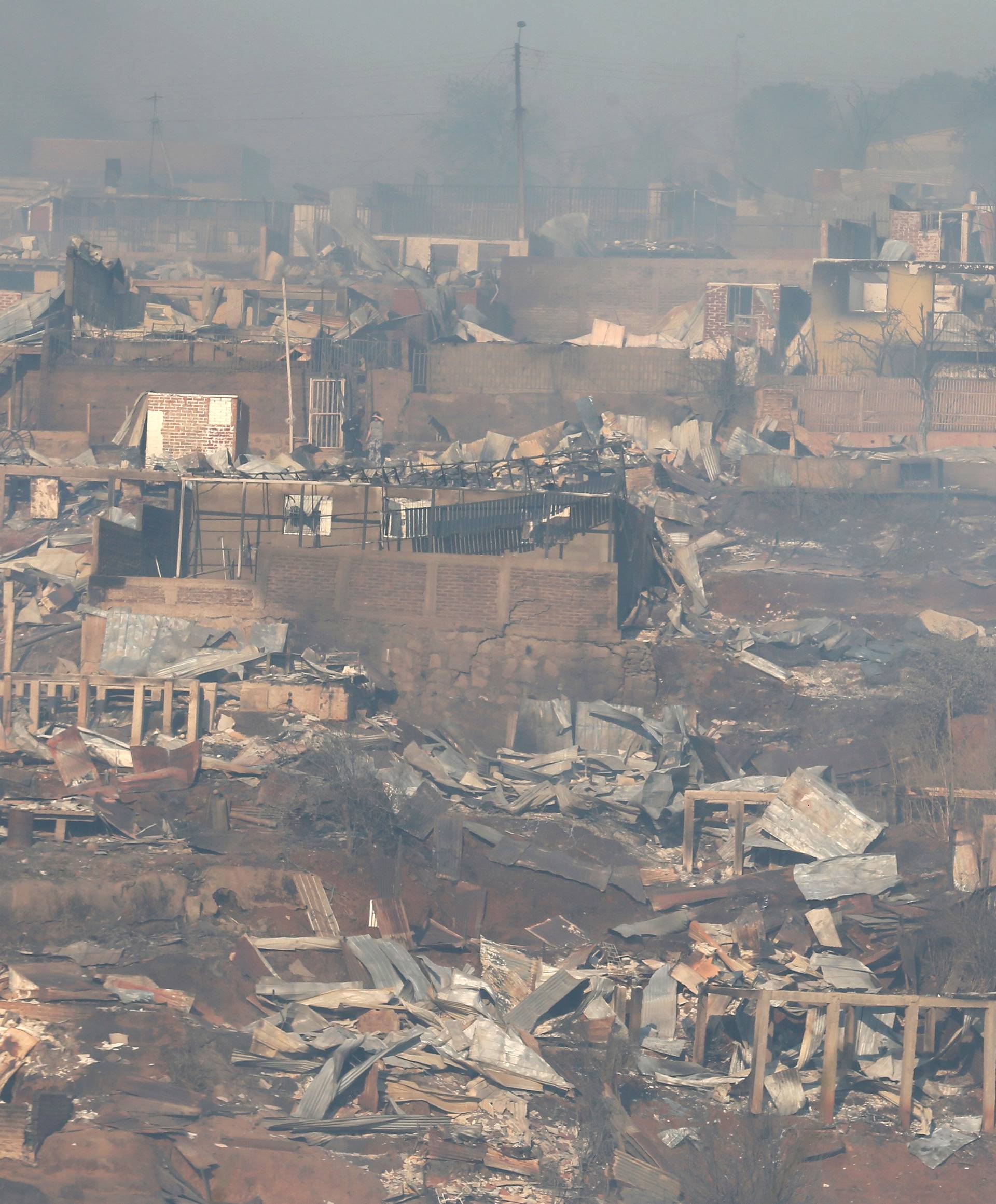 Destroyed houses are seen on a hill, where more than 100 homes were burned due to a forest fire but there have been no reports of death, local authorities said in Valparaiso, Chile