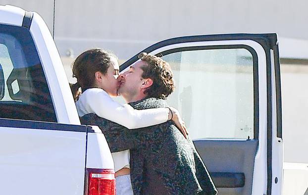*PREMIUM EXCLUSIVE NO WEB UNTIL 3PM EST 21ST DEC* New Couple Alert!! Shia LaBeouf attempts to put his recent troubles behind him as he takes part in a major PDA session with actress and model Margaret Qualley